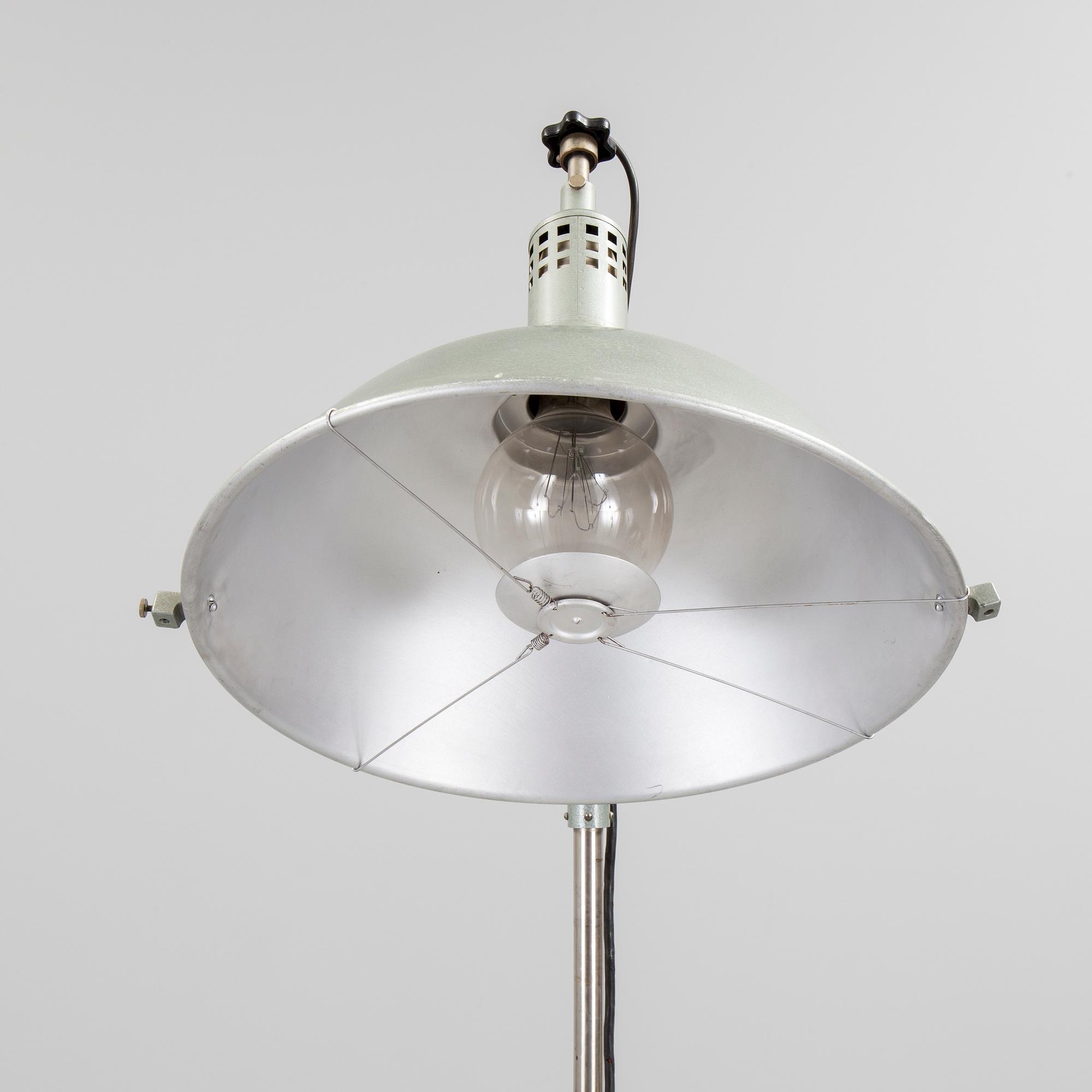 A German metal floor light from the mid 20th century.