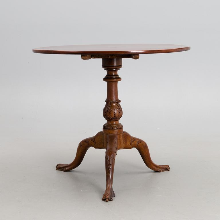 A 18th century mahogany English tilt top table.