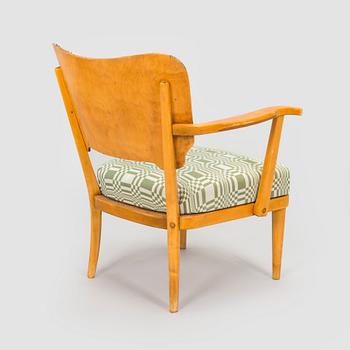 A mid-20th century armchair upholstered with fabric by Johanna Gullichsen.