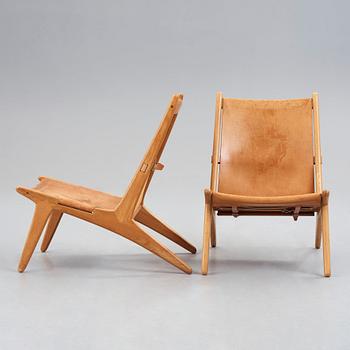 UNO & ÖSTEN KRISTIANSSON, a pair of "Hunting chairs" model 204, for Luxus, Vittsjö, Sweden 1960's.