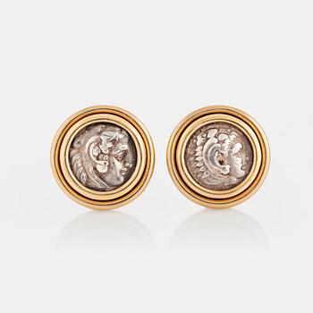 1032. A pair of Bulgari "Monete" earrings in 18K gold set with ancient coins.