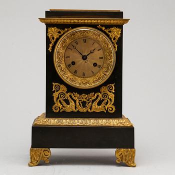 An Empire-style late 19th century mantel clock.