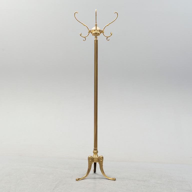 a brass coat hanger from the late 20th century.