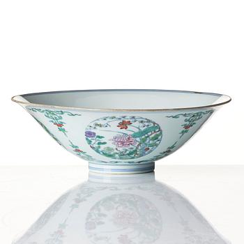 A doucai 'floral' bowl, Qing dynasty, Yongzheng mark and of the period (1723-35).