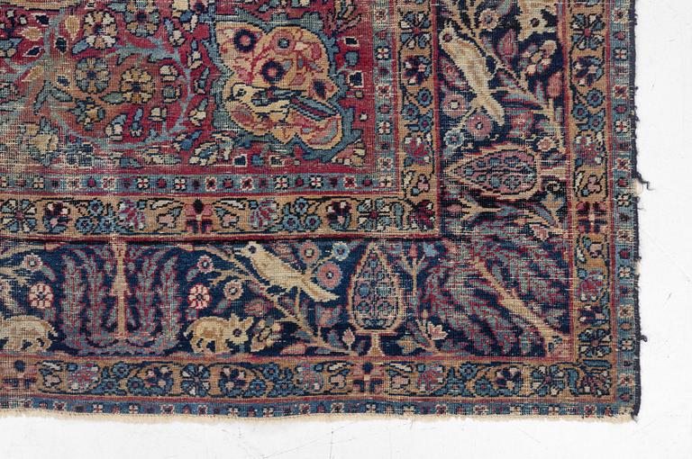 A semi-antique Kerman carpet, c. 325 x 203 cm.