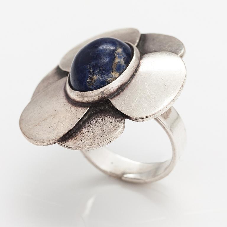 Eila Minkkinen, A sterling silver ring "Wild rose" with a sodalit. Kalevala Koru, Helsinki 1973.