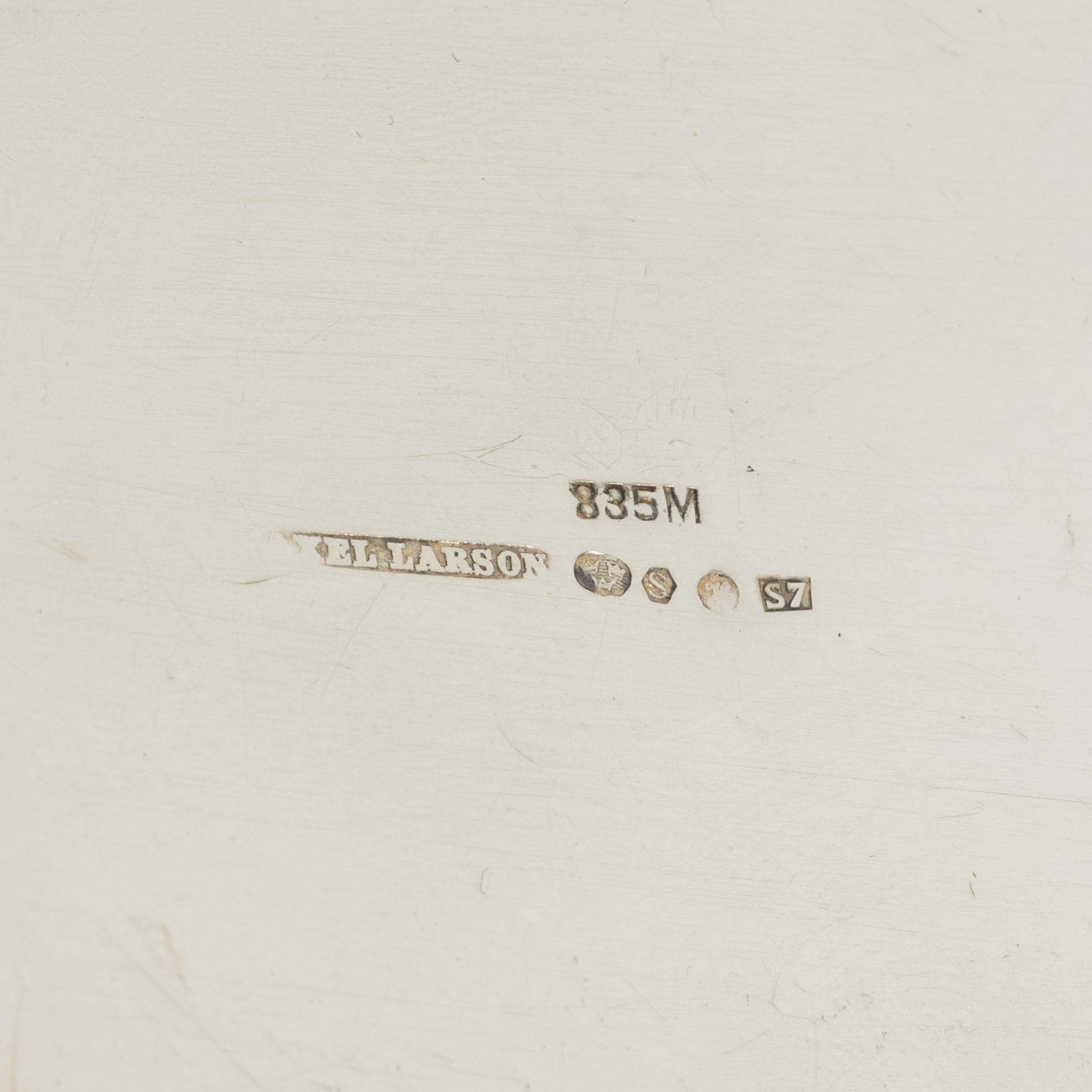 A silver coffee pot, creamer and sugar bowl, import marks of Axel Larson, Helsingborg 1920.