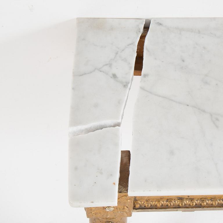 A Swedish Gustavian style mirror and console table with marble top from the first half of the 20th century.