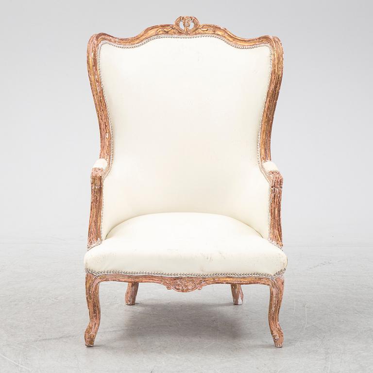 A gilt Louis XV style bergère, first half of the 20th Century.