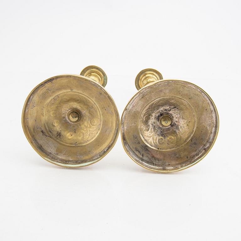 A pair of 19th century brass candle sticks.