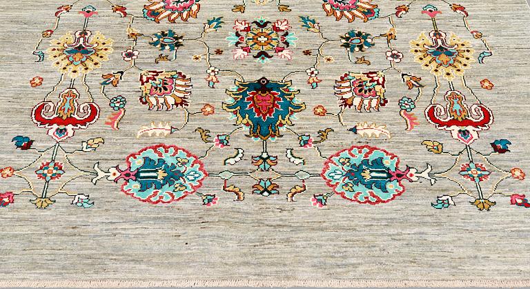 A rug, of 'Ziegler' Design, c 238 x 164 cm.