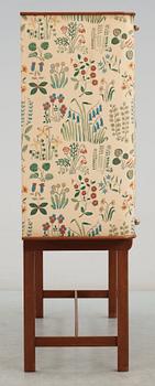 A Josef Frank mahogany cabinet, doors and sides covered in Frank's floral chintz fabric 'Fatima', Svenskt Tenn ca 1937.