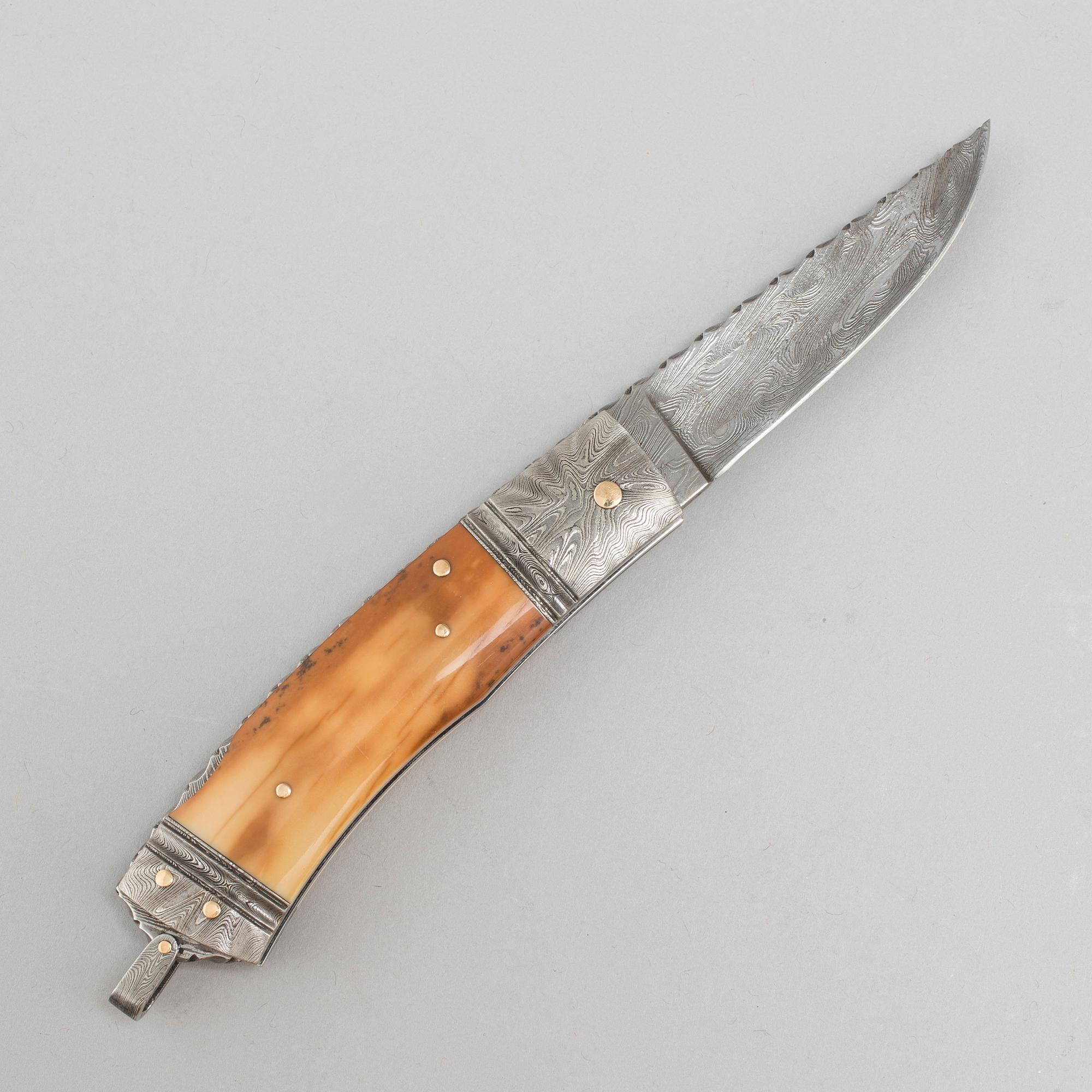 Kaj Embretsen, a damascus steel folding knife, signed.
