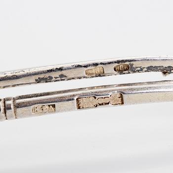 Three silver tea glass holders and four spoons, silver Kostroma and Moscow, late 19th and early 20th centuries.