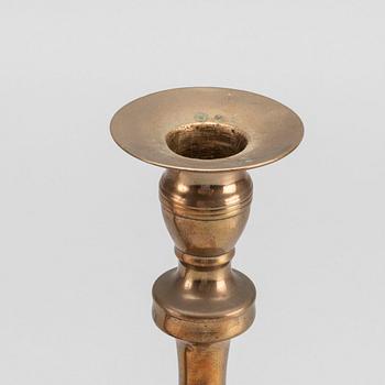 A PAIR OF EMPIRE CANDLESTICKS.