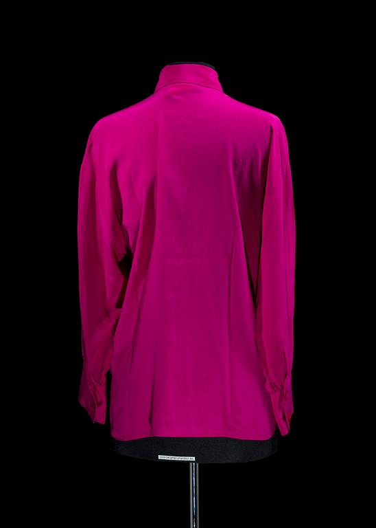 A 1980s cerise silk blouse by Yves Saint Laurent.