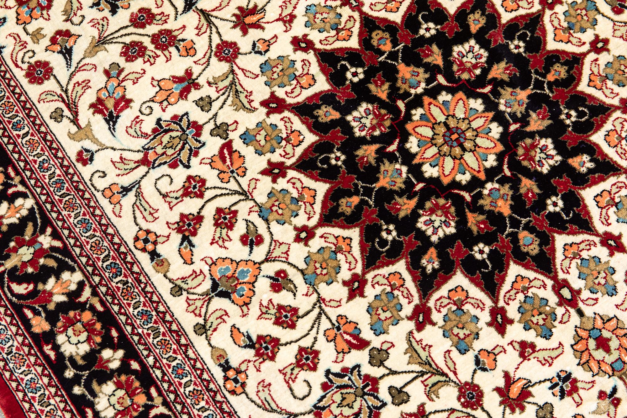 A carpet, Silk Qum, ca 116 x 75 cm.