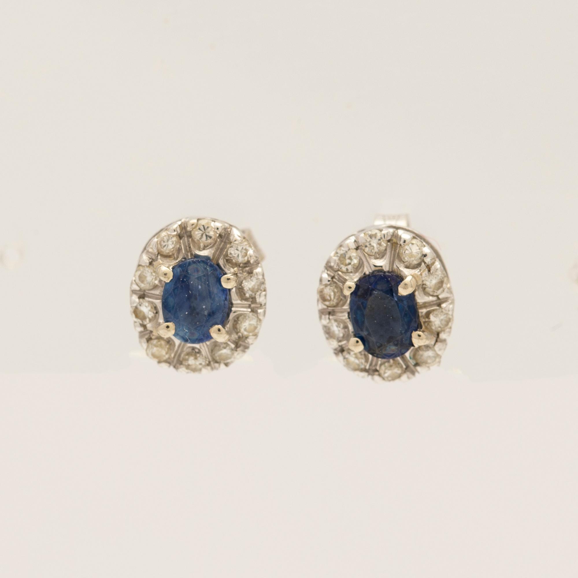 Earrings, a pair, 18k white gold with brilliant-cut diamonds and sapphire.