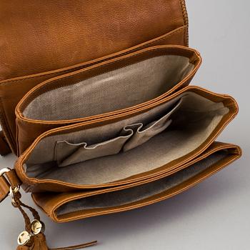 A 'Marrakech Medium Messenger Bag' by Gucci.