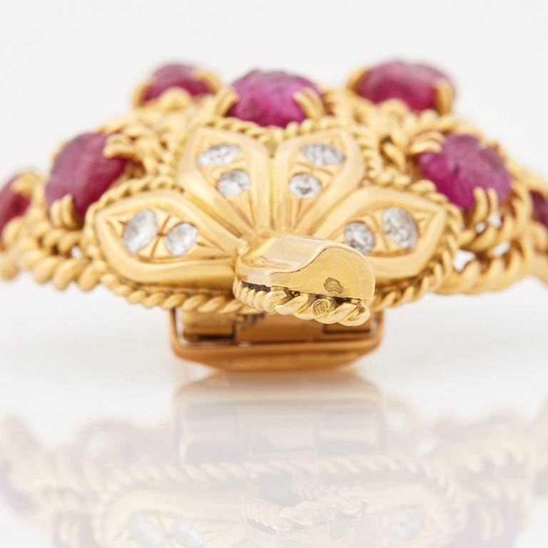A 1950/60's brooch by Cartier, in the shape of a strawberry, set with carved rubies and brilliant cut diamonds.