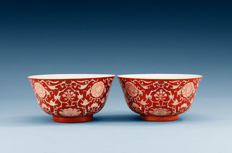 Two reserved-decorated coral-ground bowls, Qing dynasty with Daoguang´s seal mark and of the period (1821-50).