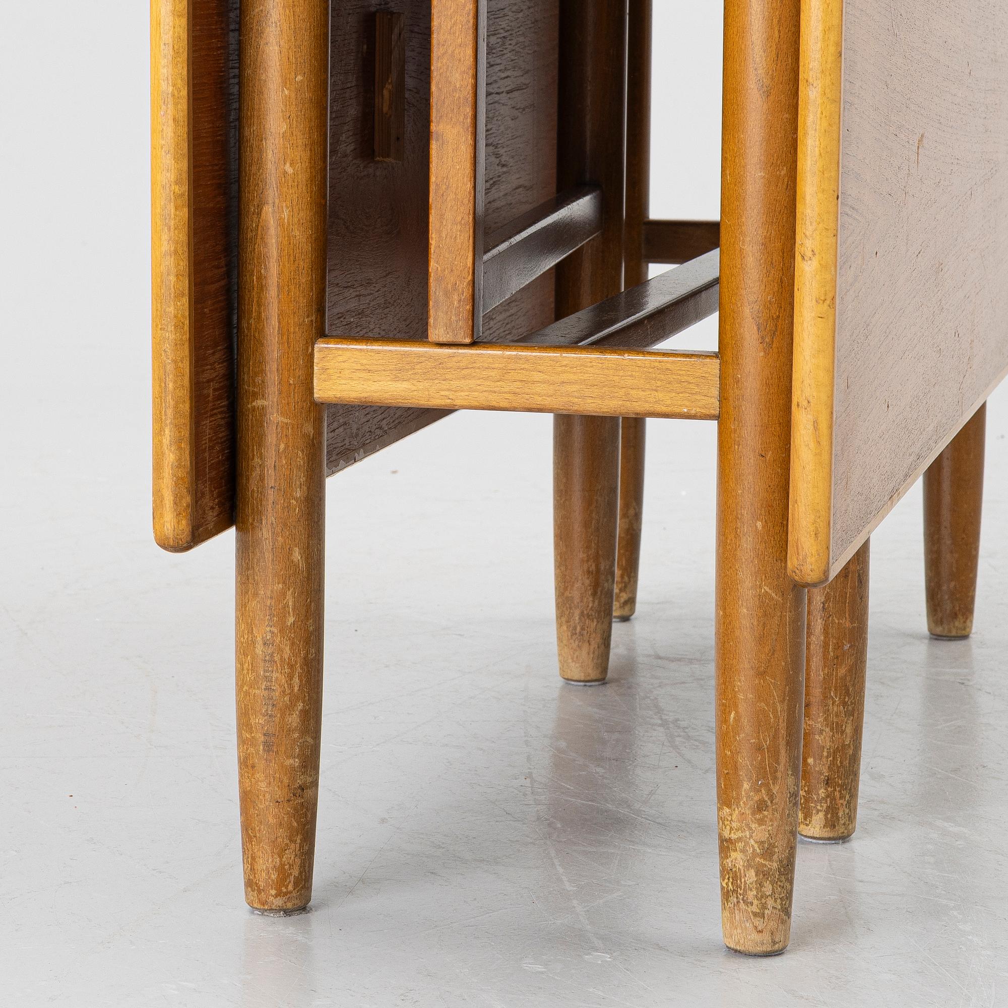 A mid20th century gate-leg table.