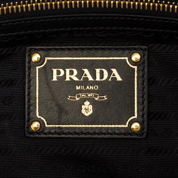 A black leather bag/clutch by Prada.