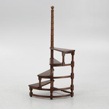 A late 20th century spiral library ladder.