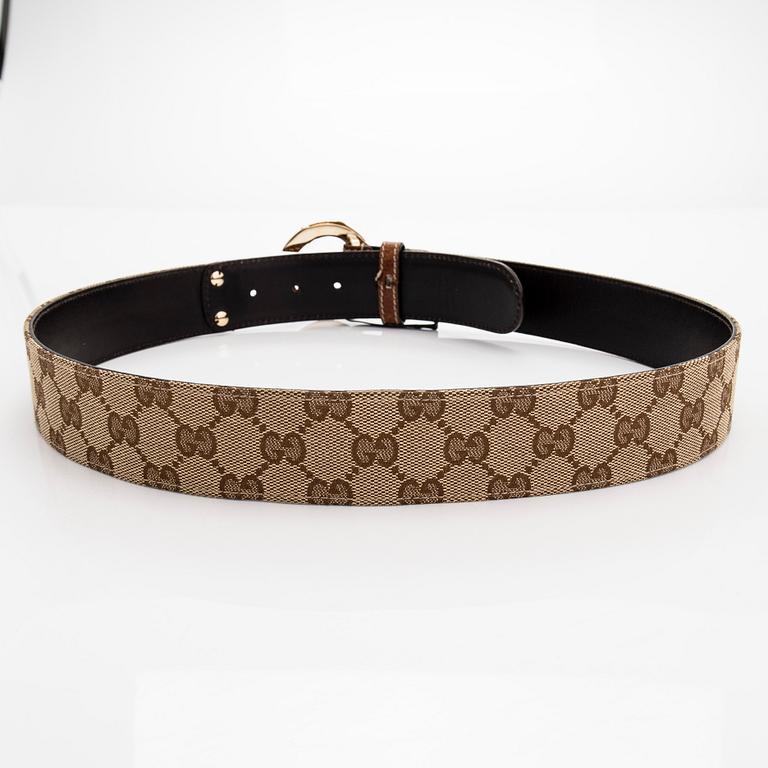 A Gucci monogram canvas leather belt.