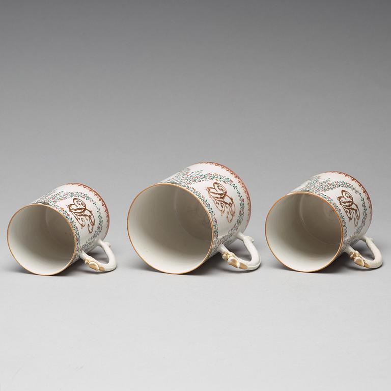 A group of three famille rose armorial jugs, Qing dynasty, Qianlong (1736-95).