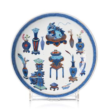 1254. A doucai '100 antiques' dish, Qing dynasty, 18th Century with a Ming mark.