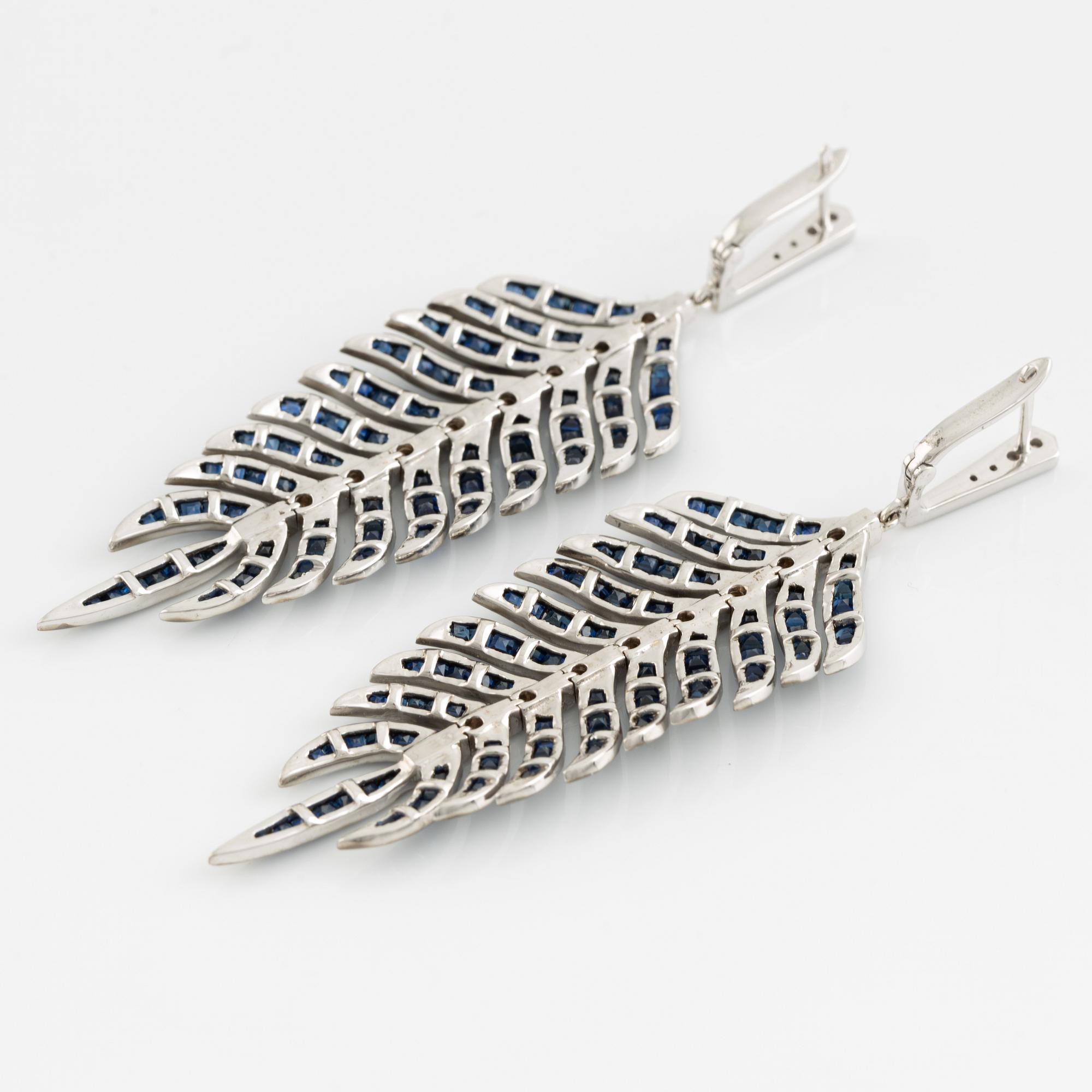 Sapphire and brilliant cut diamond feather earrings.