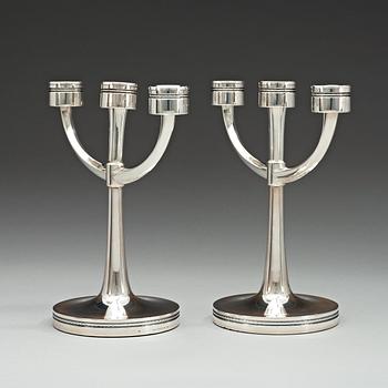 A pair of Erik Löfman silver candelabra, MGAB, Uppsala 1975.