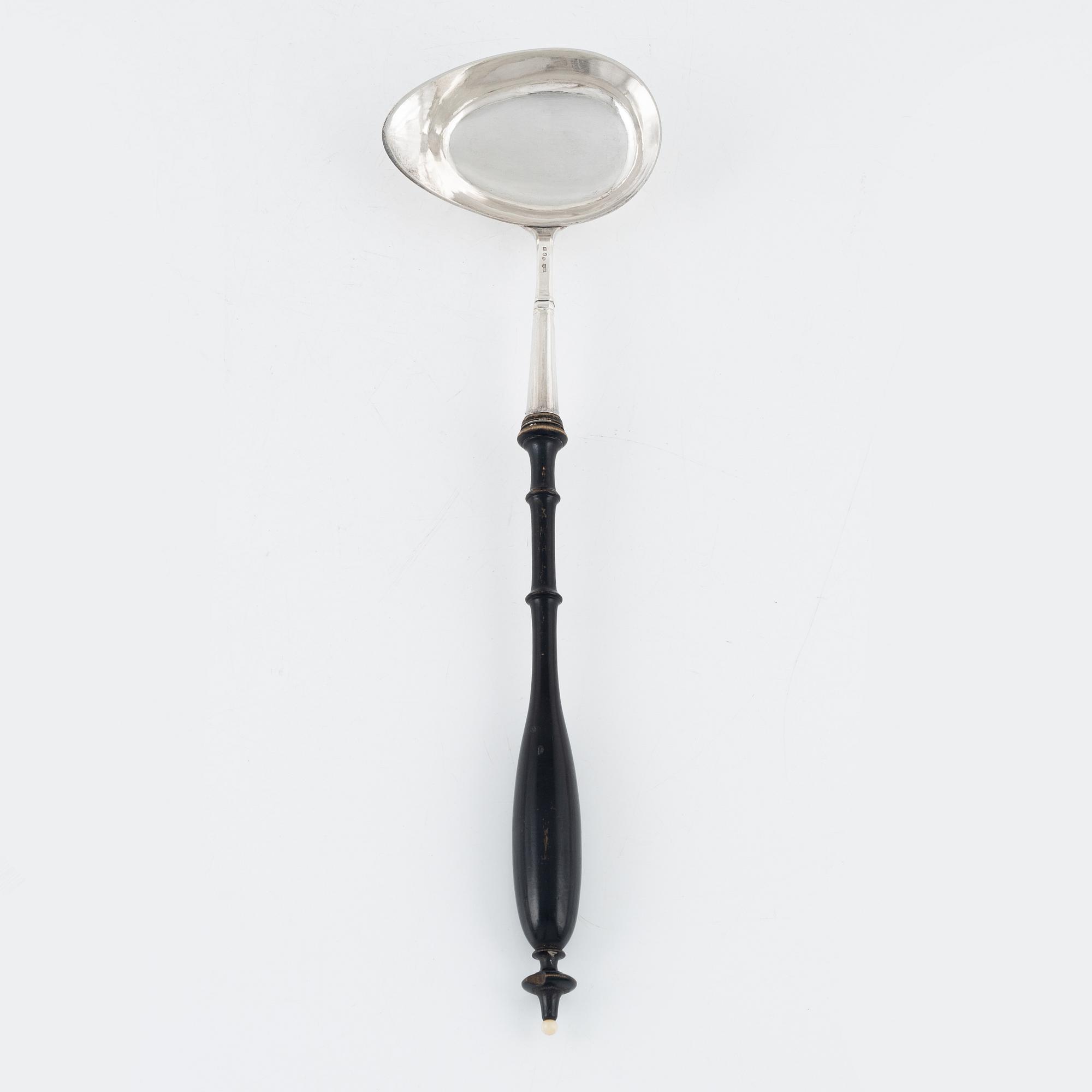 A Swedish Silver Ladle, mark of Adolf Öström, Piteå 1887 and a pair of Silver Candlesticks.