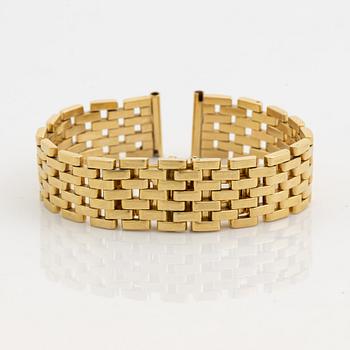 An 18K gold watch bracelet.