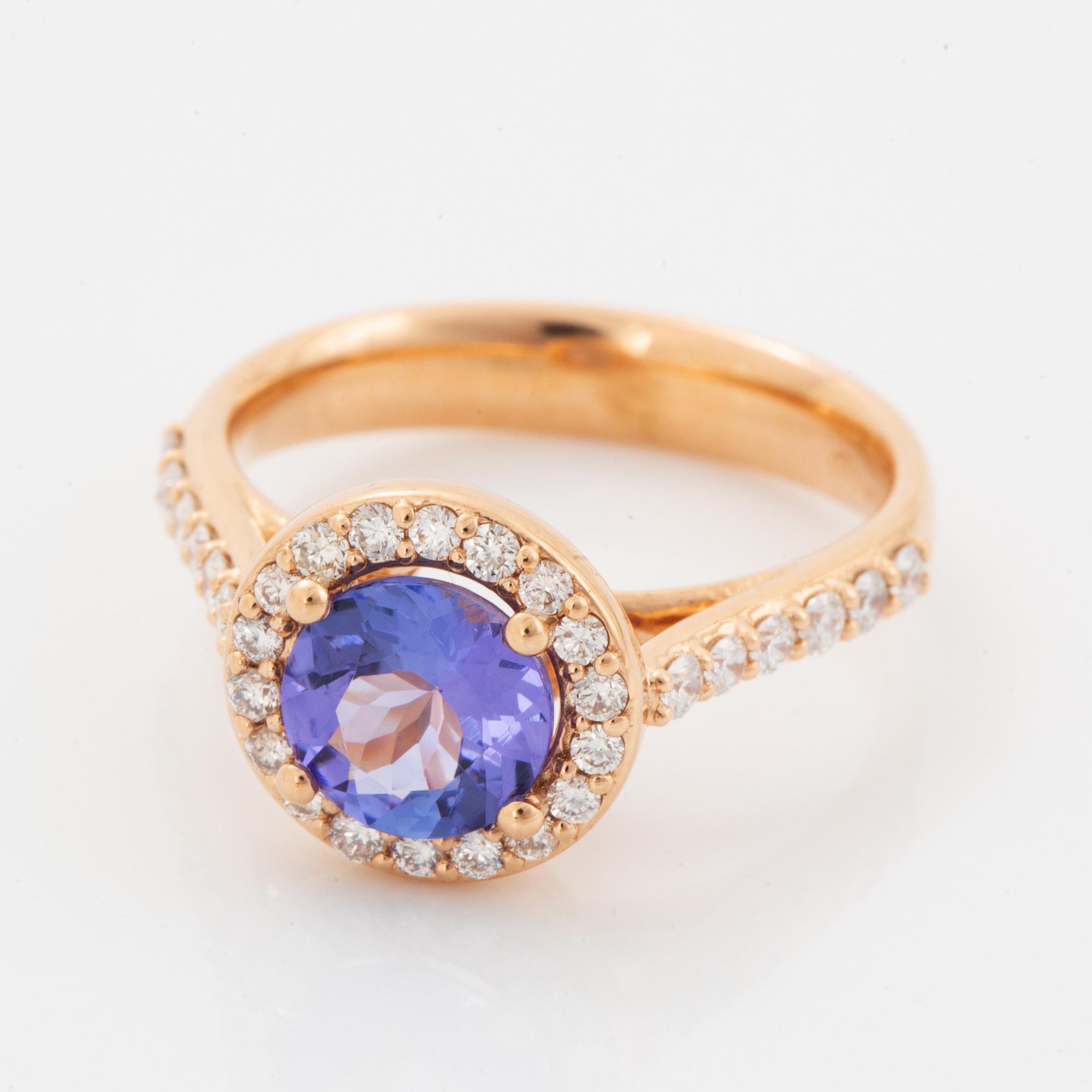 Ring 18K guld med en fasettslipad tanzanit.