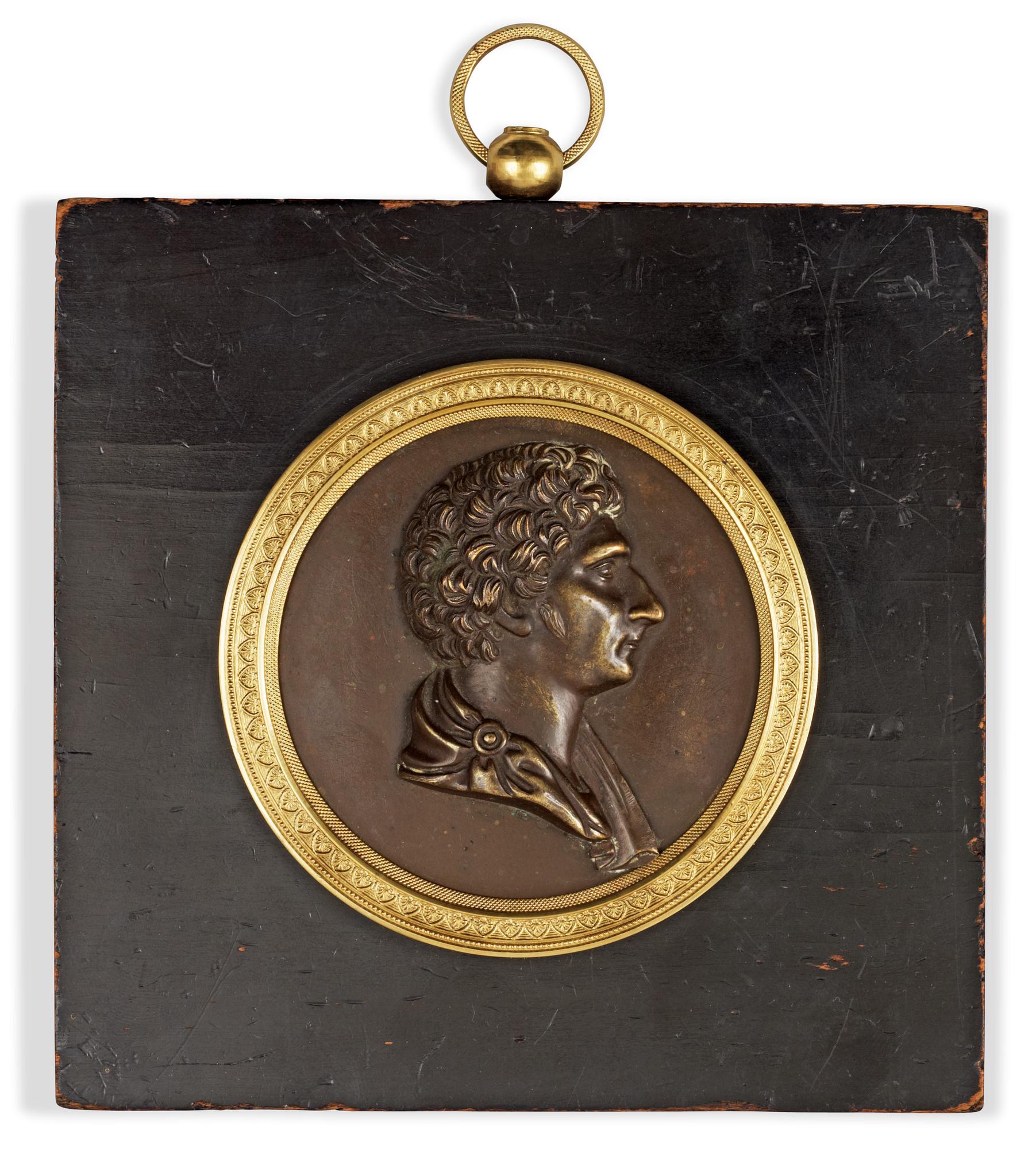A Swedish Empire 19th century bronze portrait medallion representing Karl XIV Johan.