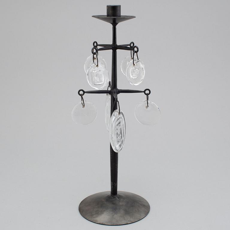 an iron and glass candlestick.