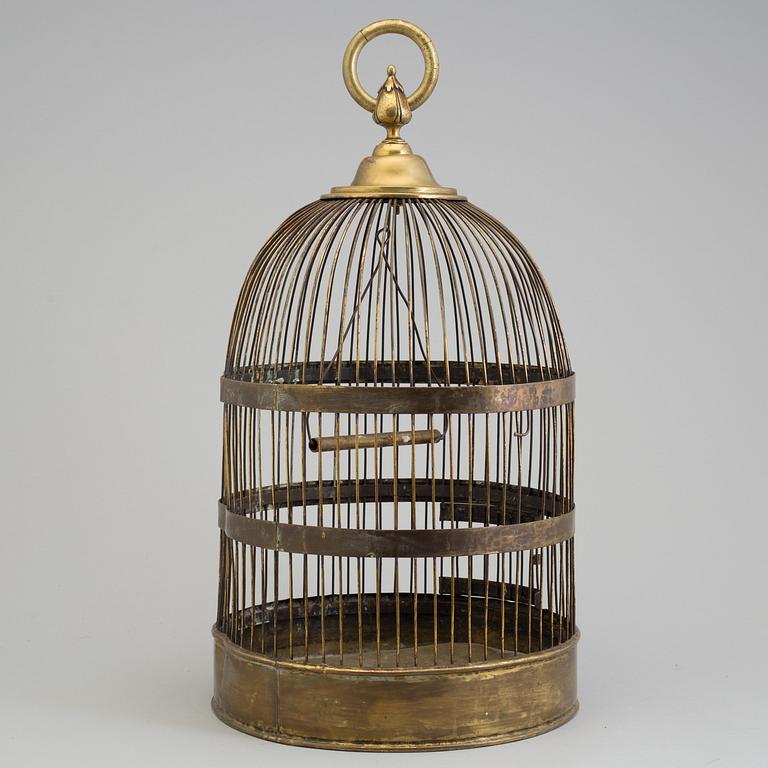 A 19TH CENTURY BRASS BIRD CAGE.