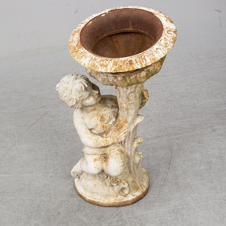 An end of the 20th Century cast iron flower pot.