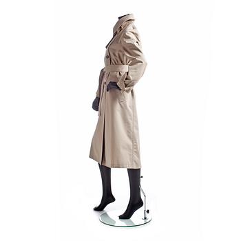 GUCCI, a beige cotton blend trenchcoat.
