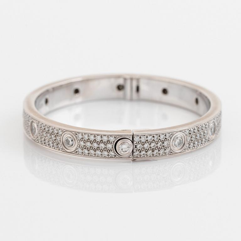 A Cartier "Love" bracelet in 18K white gold set with round brilliant-cut diamonds.