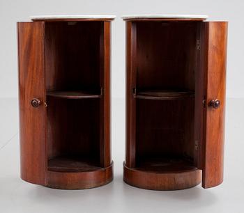 A pair of Empire 19th cent mahogany cupboards.