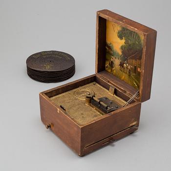 Polyphon wooden music box with fifteen discs, Germany, c. 1900.