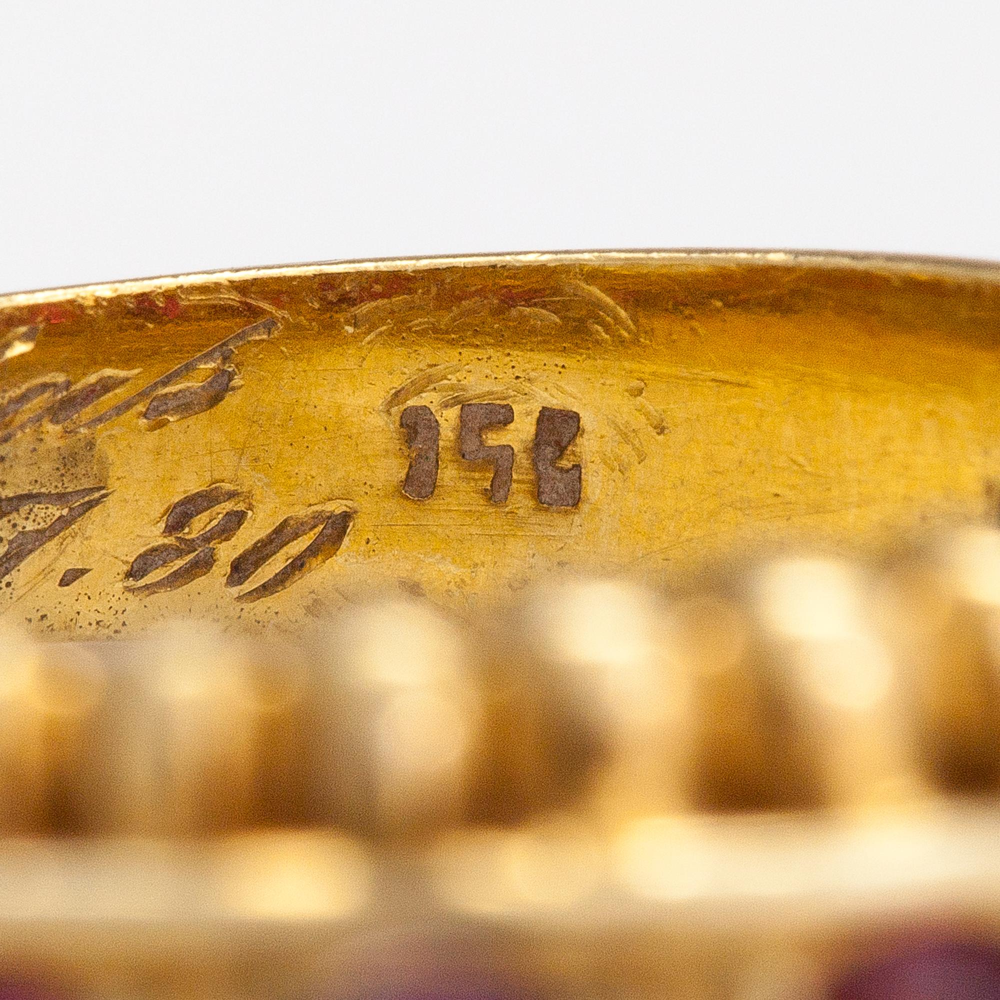 An 18K gold ring with rubies. Italy, finnish import marks.