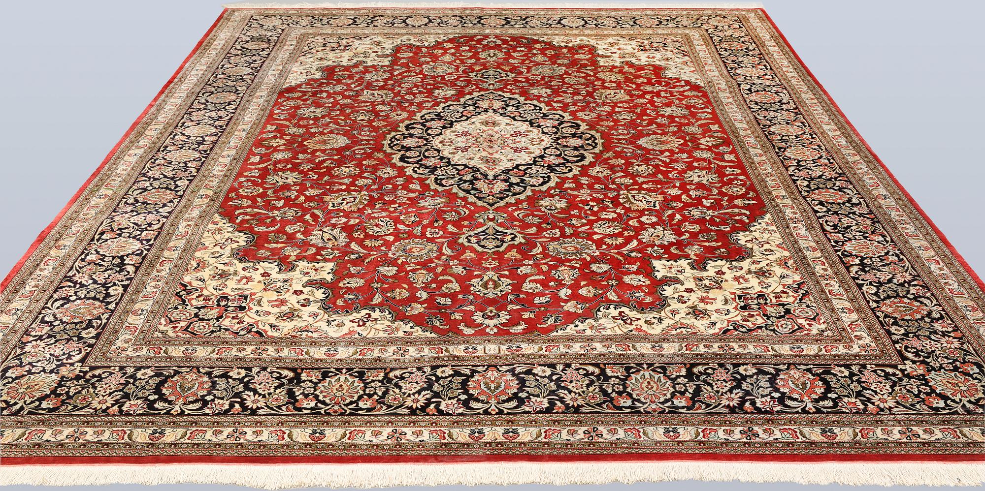A silk Ghom carpet, c. 346 x 247 cm.