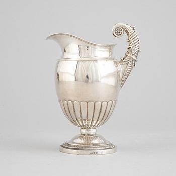 A Swedish empire parcel gilt silver creamer, mark of Anders Lundqvist, Stockholm 1828.