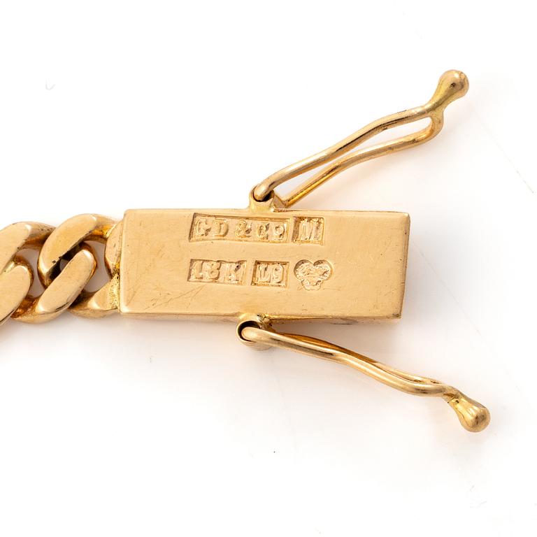 Gustaf Dahlgren & Co, Malmö, 1961. Bracelet in 18K gold with a centrepiece in 14K gold and garnets.