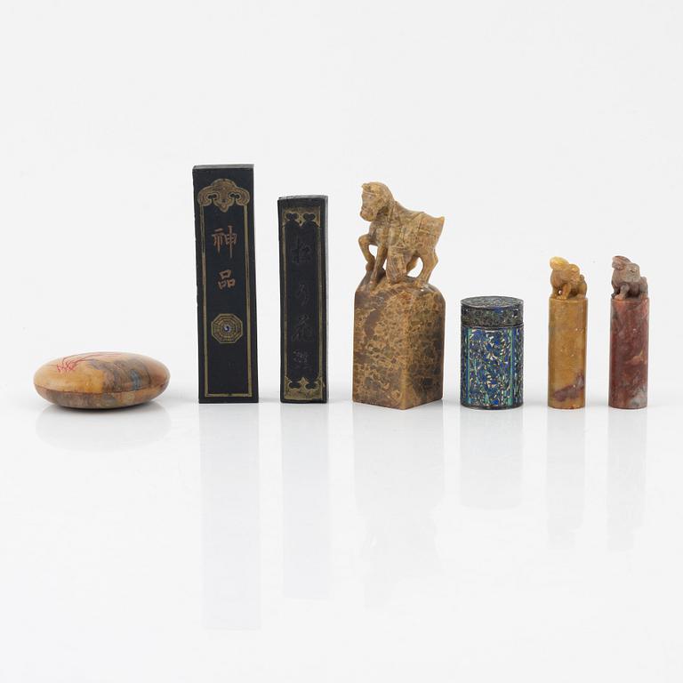 A set of four stone scholars objects and a enameled silver box with cover, Qing dynasty, circa 1900.