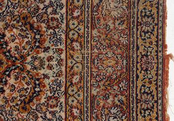 A semi-antique oriental carpet, c. 290 x 195 cm.